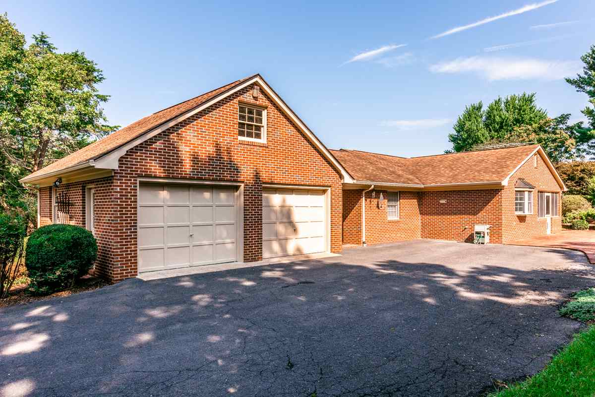 868 Todd Road Mount Sidney, VA 24467 - Photo 25 of 47 a front view of a house with a yard and garage