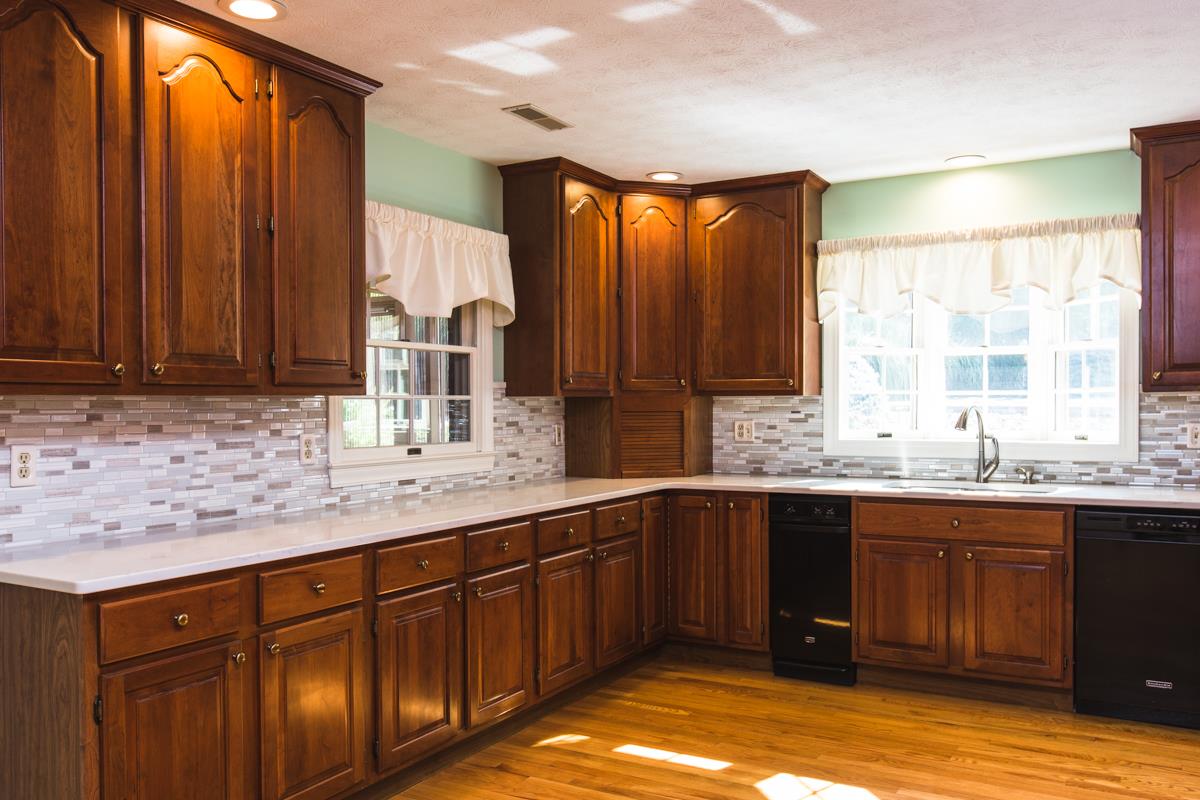 868 Todd Road Mount Sidney, VA 24467 - Photo 7 of 47 a kitchen with stainless steel appliances granite countertop wooden cabinets a sink and dishwasher
