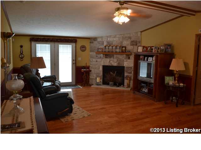 1650 Hickory Ridge Road Waddy, KY 40076 - Photo 4 of 17 Great room with wood burning fireplace and new laminate floor.