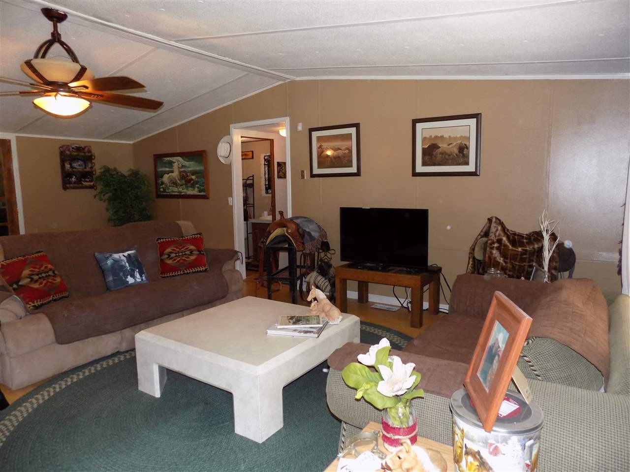 360 County Farm Road Madisonville, TN 37354 - Photo 14 of 32 a living room with furniture a flat screen tv and a table