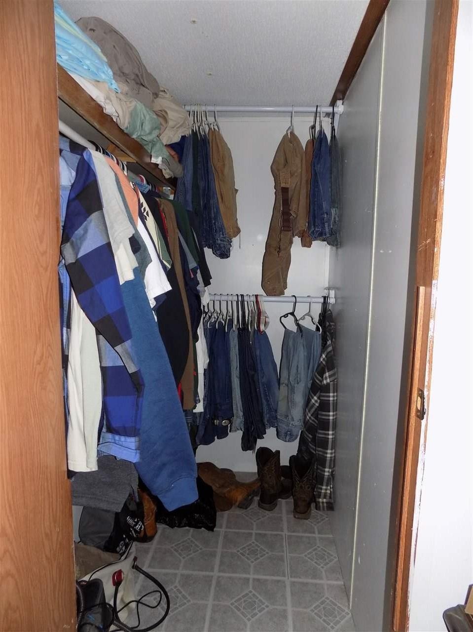 360 County Farm Road Madisonville, TN 37354 - Photo 23 of 32 a view of walk in closet with clothes and shoes