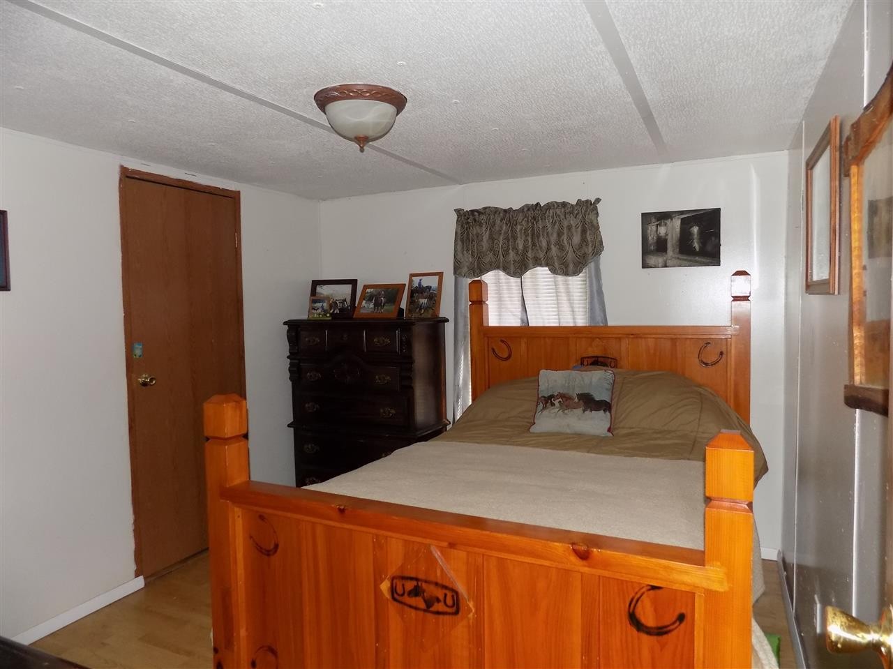 360 County Farm Road Madisonville, TN 37354 - Photo 27 of 32 a bedroom with a bed and dresser