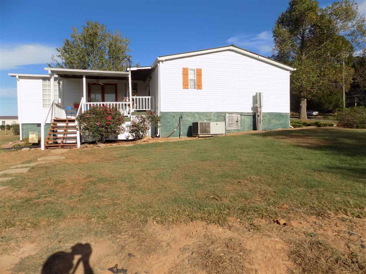 360 County Farm Road Madisonville, TN 37354 - Photo 5 of 32 a front view of house with yard and trees in the background
