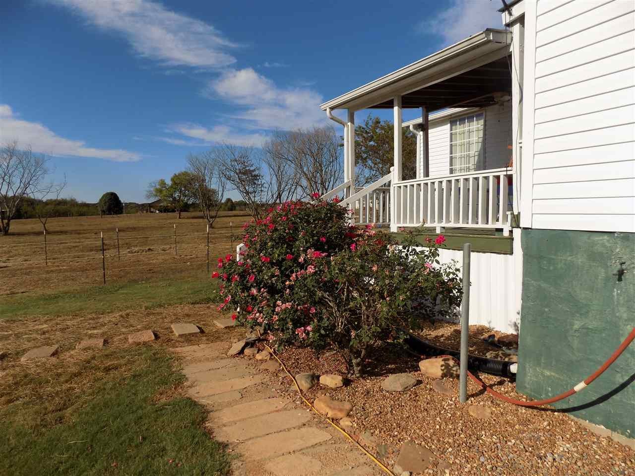 360 County Farm Road Madisonville, TN 37354 - Photo 6 of 32 a view of a house with backyard and sitting area