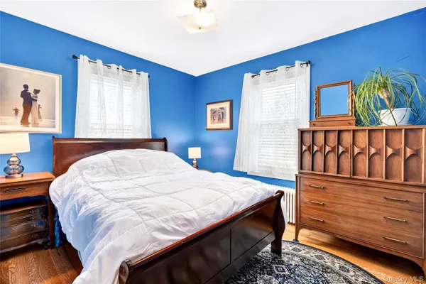 a bedroom with a bed and a table