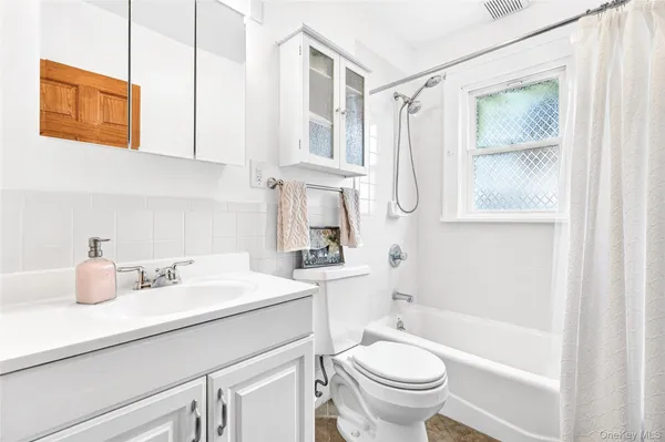 a utility room with a sink dryer and washer