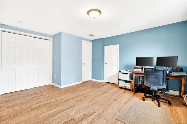 a bedroom with a workspace