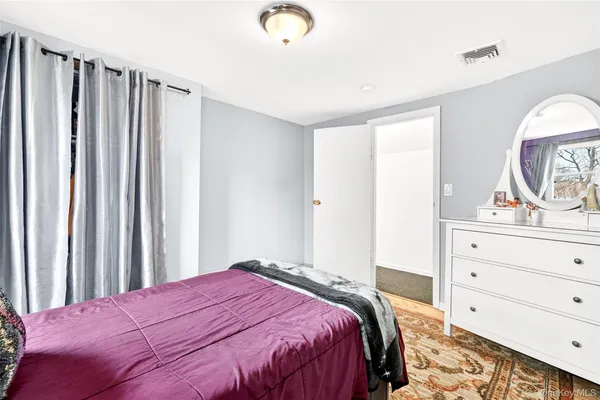 a view of a dining room with furniture and a window