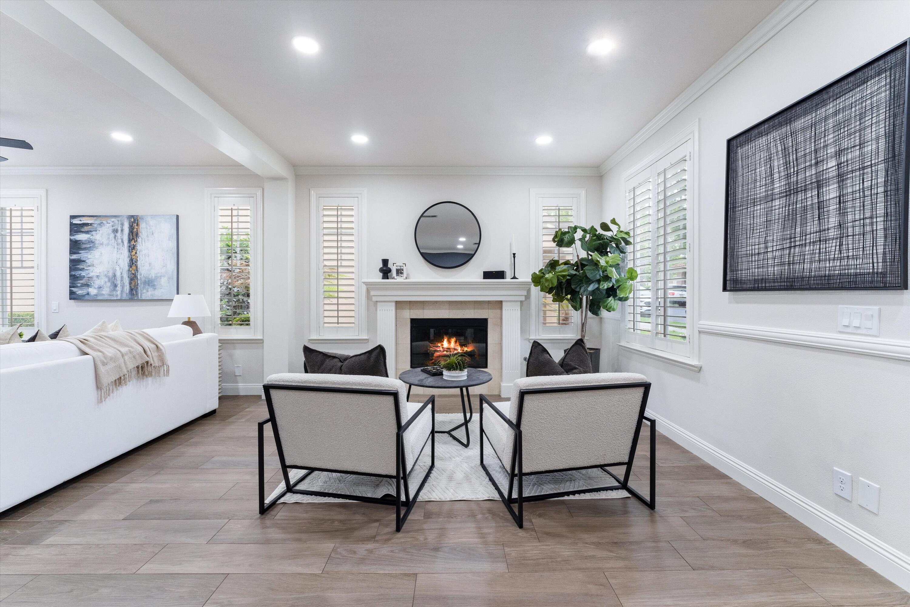 19 Clematis Street Ladera Ranch, CA 92694 - Photo 3 of 45 a living room with furniture and a fireplace