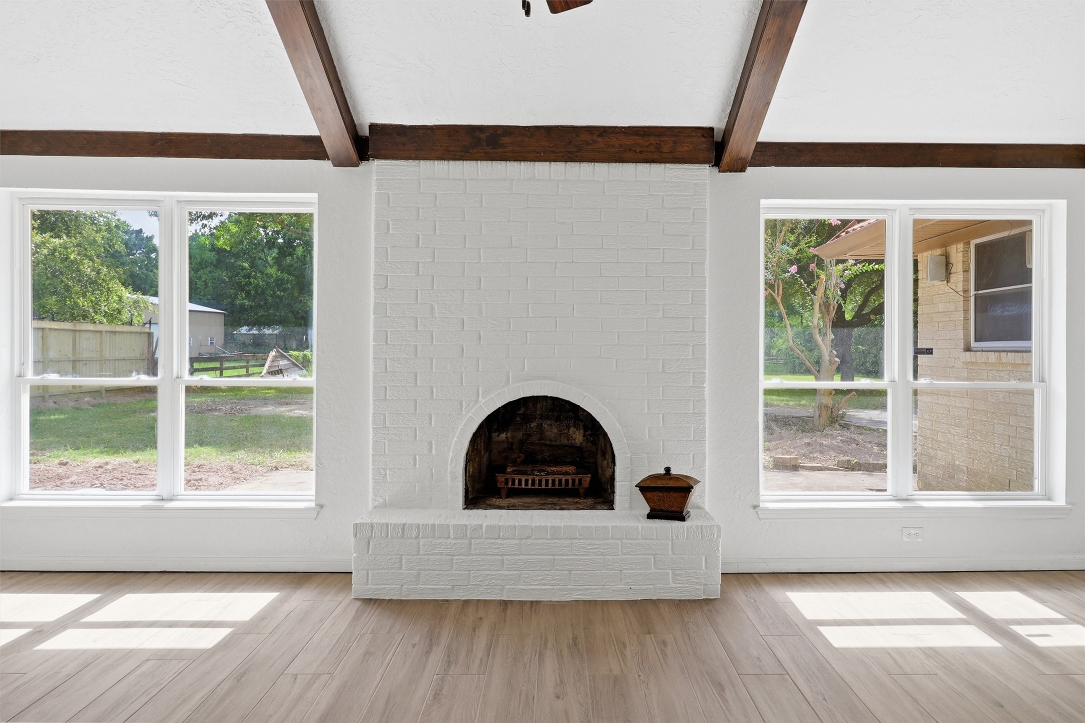 22923 Tomball Cemetery Road Tomball, TX 77377 - Photo 12 of 50 This family room is light and bright with a wood burning fireplace!