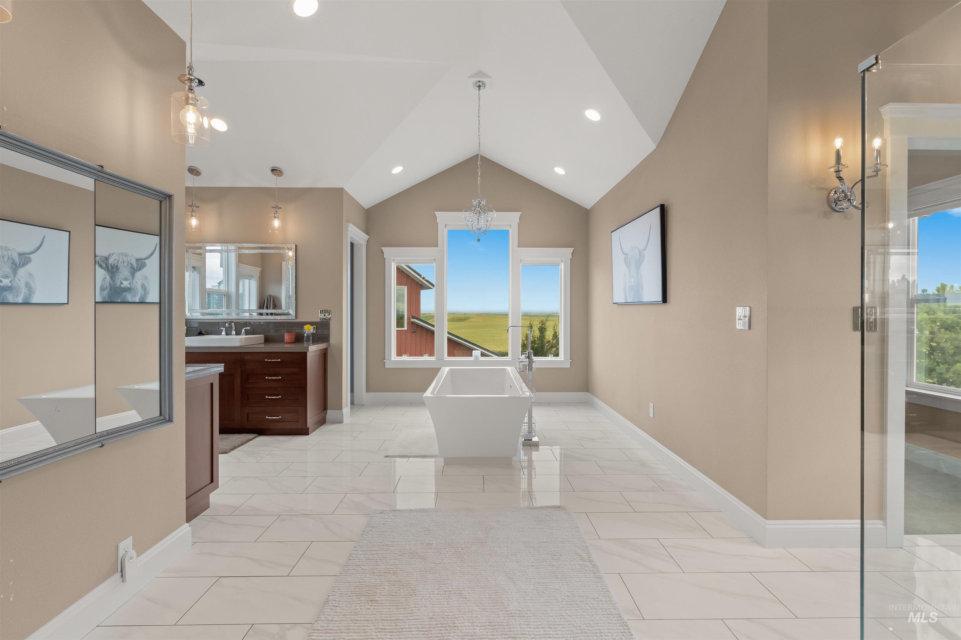 1513 Uniontown Road Genesee, ID 83832 - Photo 22 of 50 Covered concrete patio featuring a prominent brick wall and an arched brick entryway