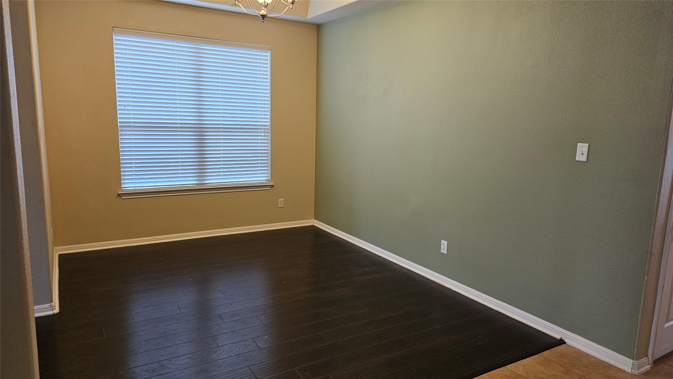 1313 Clary Sage Loop Round Rock, TX 78665 - Photo 4 of 16 an empty room with wooden floor and windows