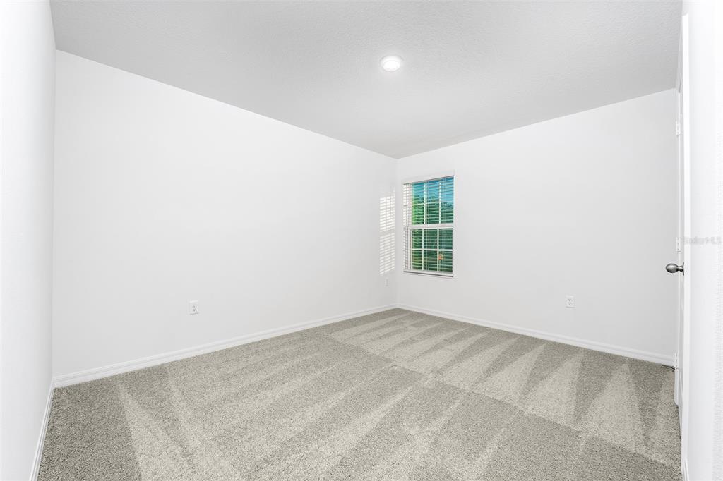 13347 Tula Loop Astatula, FL 34705 - Photo 14 of 21 an empty room with windows
