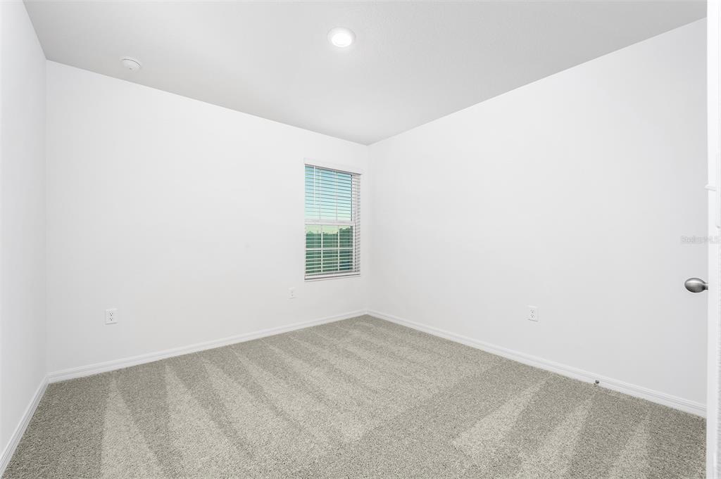 13347 Tula Loop Astatula, FL 34705 - Photo 16 of 21 an empty room with a window