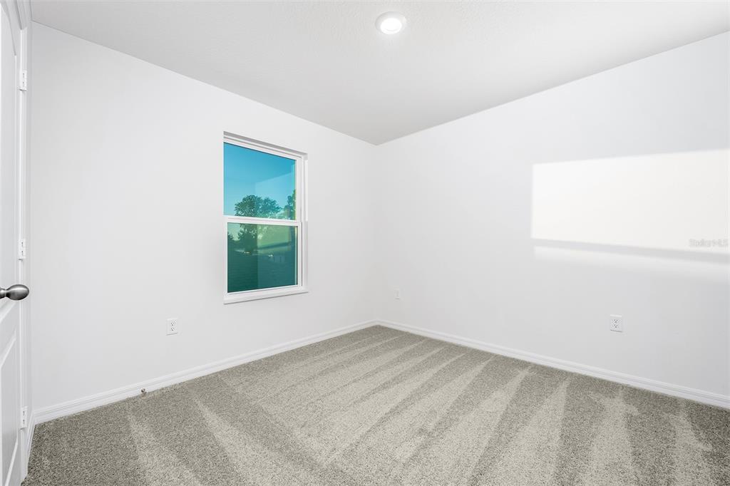13347 Tula Loop Astatula, FL 34705 - Photo 17 of 21 an empty room with a window