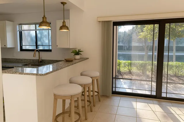 a bedroom with bed and a chandelier