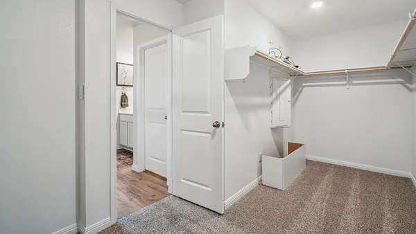 a dining room with furniture and a book shelf
