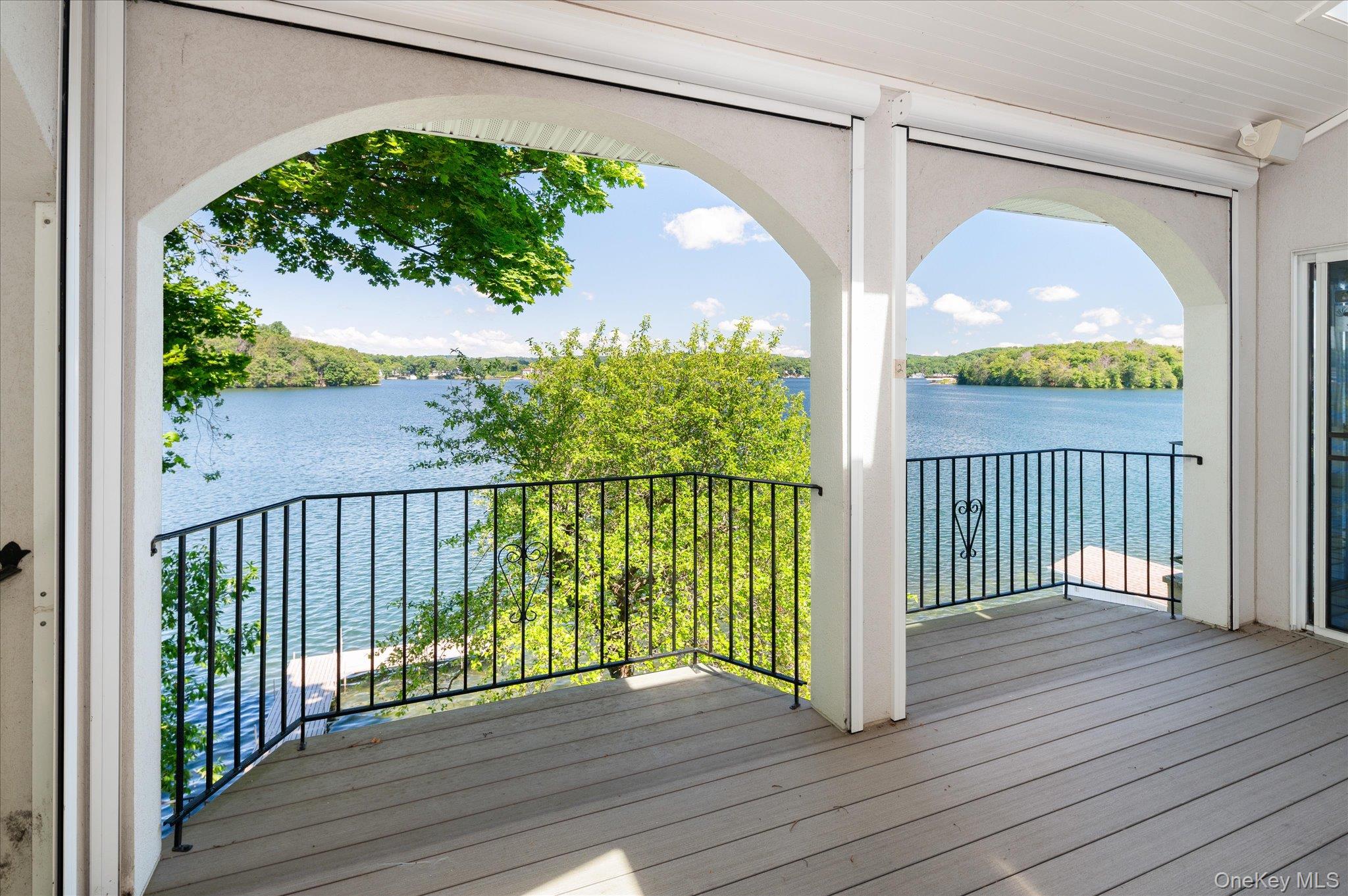 41 Tamarack Road Mahopac, NY 10541 - Photo 20 of 41 Graceful arched columns frame full views of Lake Mahopac from the indoor/outdoor living space