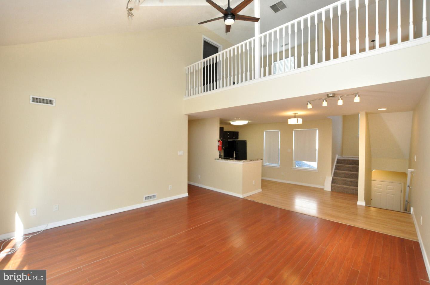 108 Quail Road Marlton, NJ 08053 - Photo 4 of 30 a view of a hallway with wooden floor and staircase