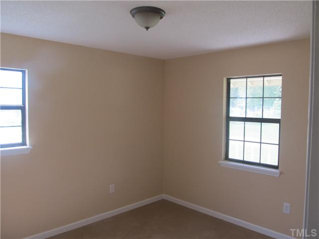 1141 Hickory Crossroads Road Kenly, NC 27542 - Photo 17 of 17 3rd bedroom with new carpet and new paint.