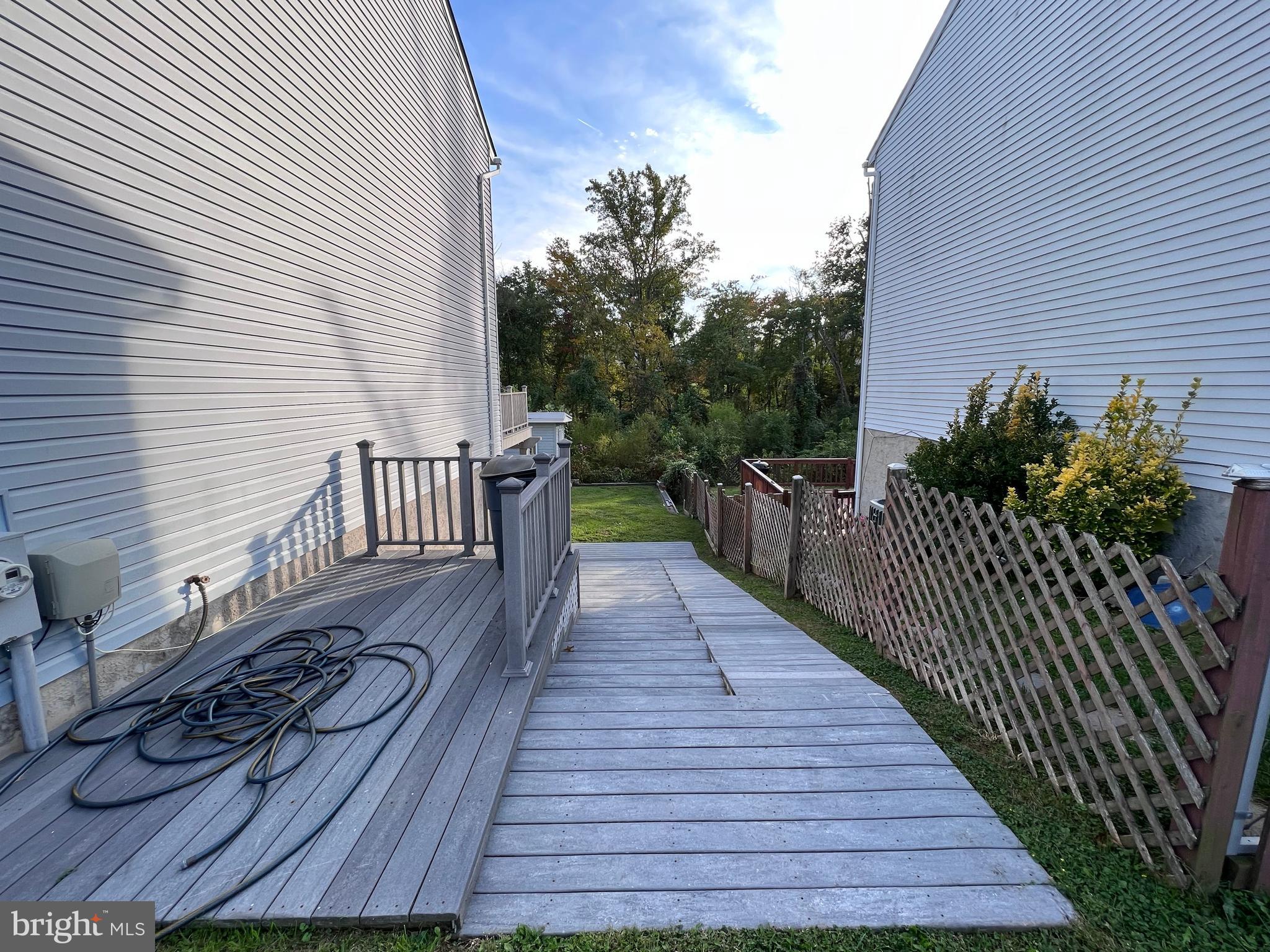 8514 Rhuddlan Road Nottingham, MD 21236 - Photo 11 of 34 a view of a wooden deck with dining space