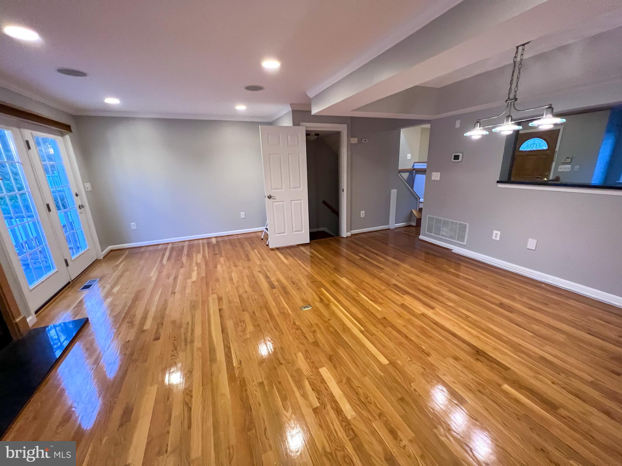 8514 Rhuddlan Road Nottingham, MD 21236 - Photo 19 of 34 a view of an empty room with wooden floor