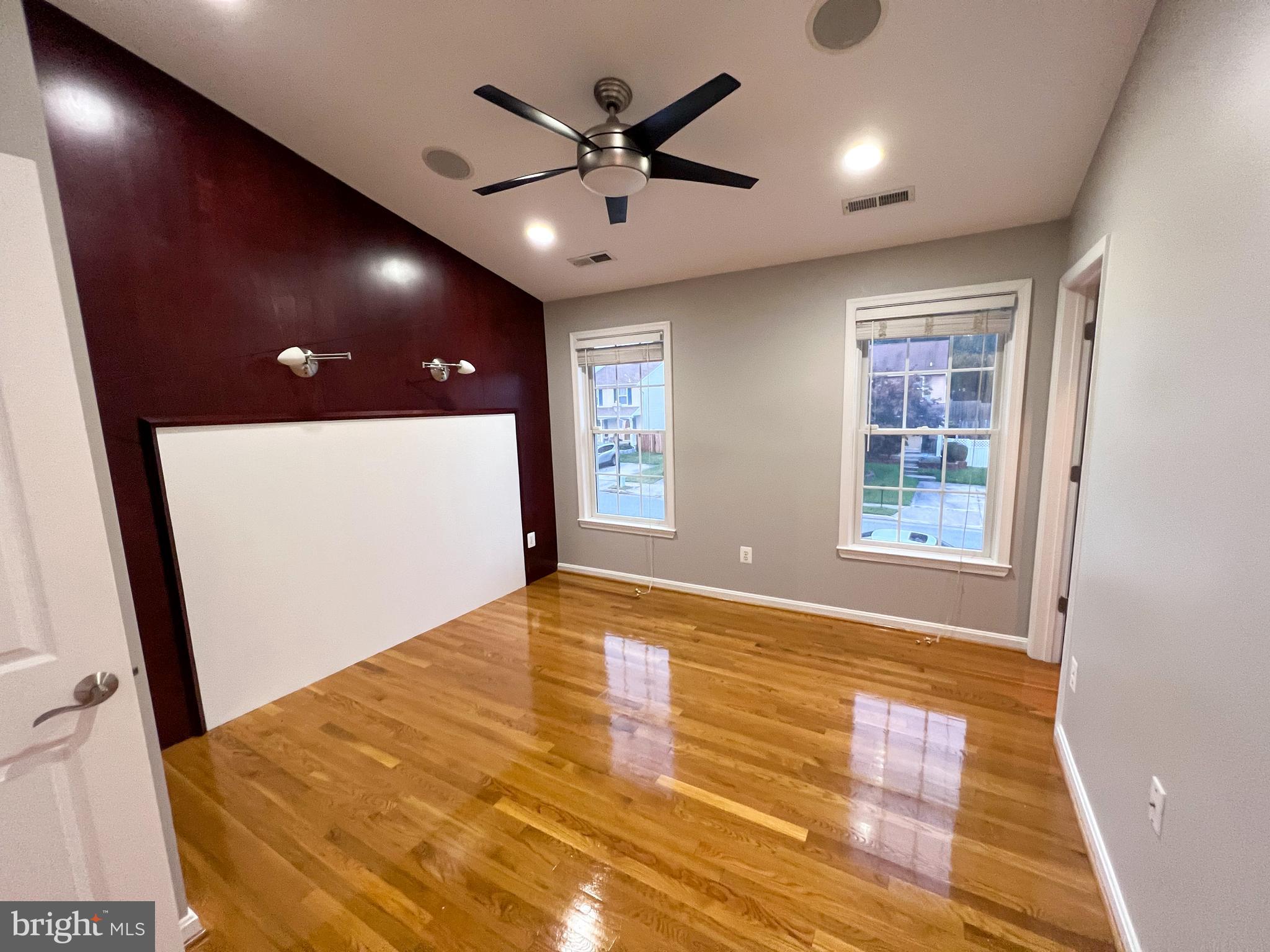 8514 Rhuddlan Road Nottingham, MD 21236 - Photo 24 of 34 a view of an empty room with window and a ceiling fan