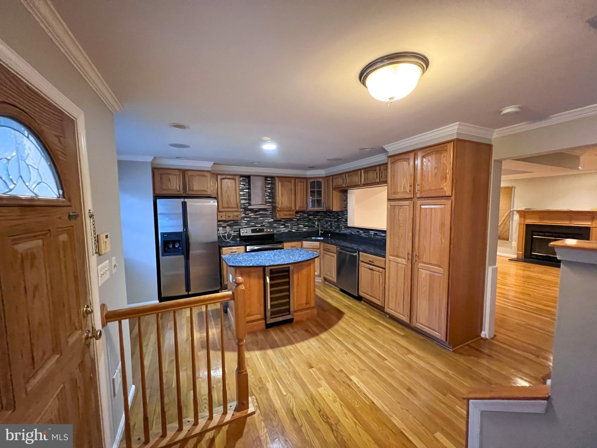 8514 Rhuddlan Road Nottingham, MD 21236 - Photo 29 of 34 a kitchen with stainless steel appliances granite countertop a refrigerator and a stove top oven