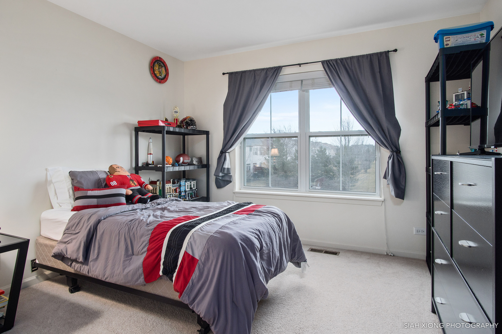 445 Dancer Lane, Unit 405 Oswego, IL 60543 - Photo 13 of 32 a bed sitting in a bedroom next to a window