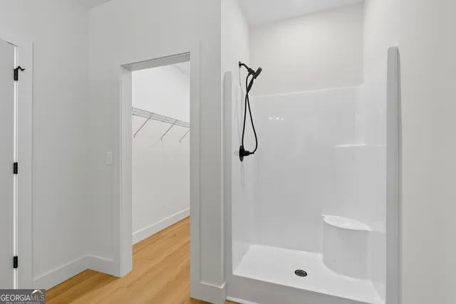 a bathroom with a glass shower door