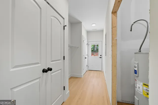 a view of a bathroom from a hallway