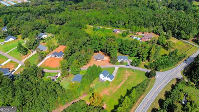 an aerial view of residential house with outdoor space and swimming pool