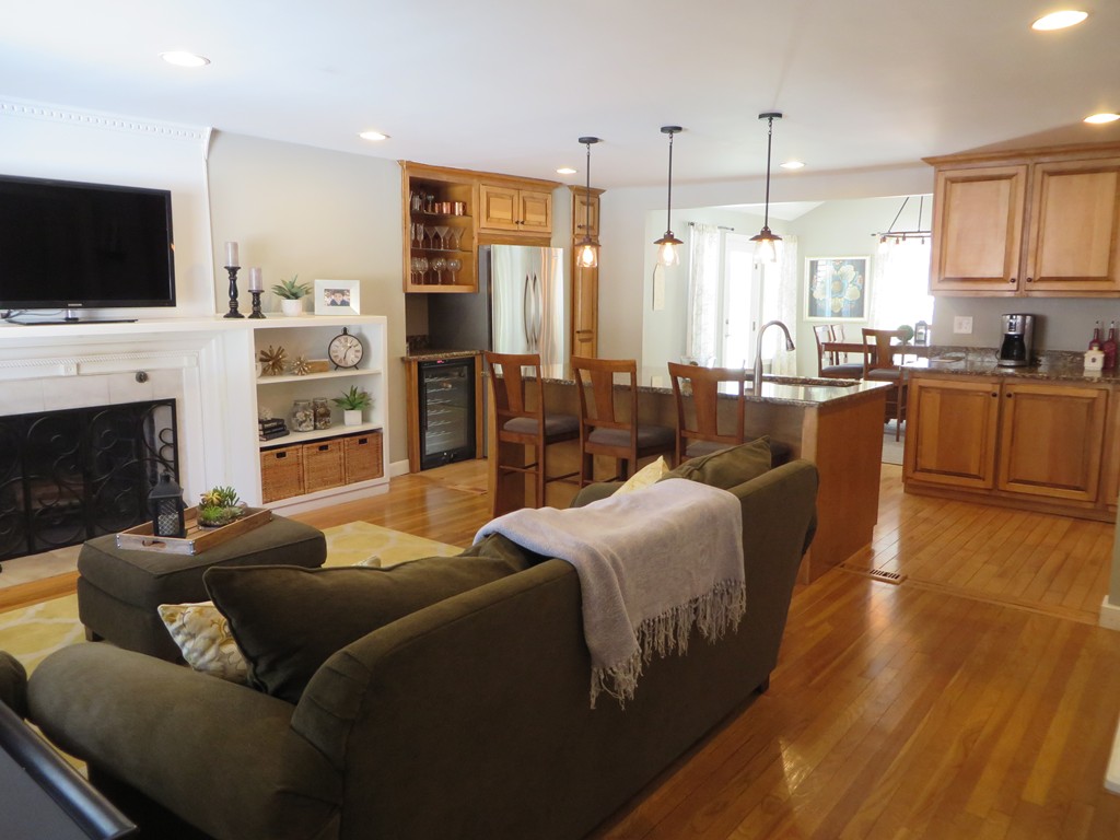 6 Davis Road Chelmsford, MA 01824 - Photo 3 of 21 a living room with furniture flat screen tv and a fireplace