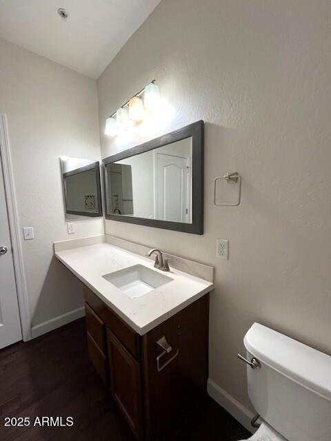 1255 South Rialto, Unit 164 Mesa, AZ 85209 - Photo 14 of 26 a bathroom with a sink a toilet and mirror