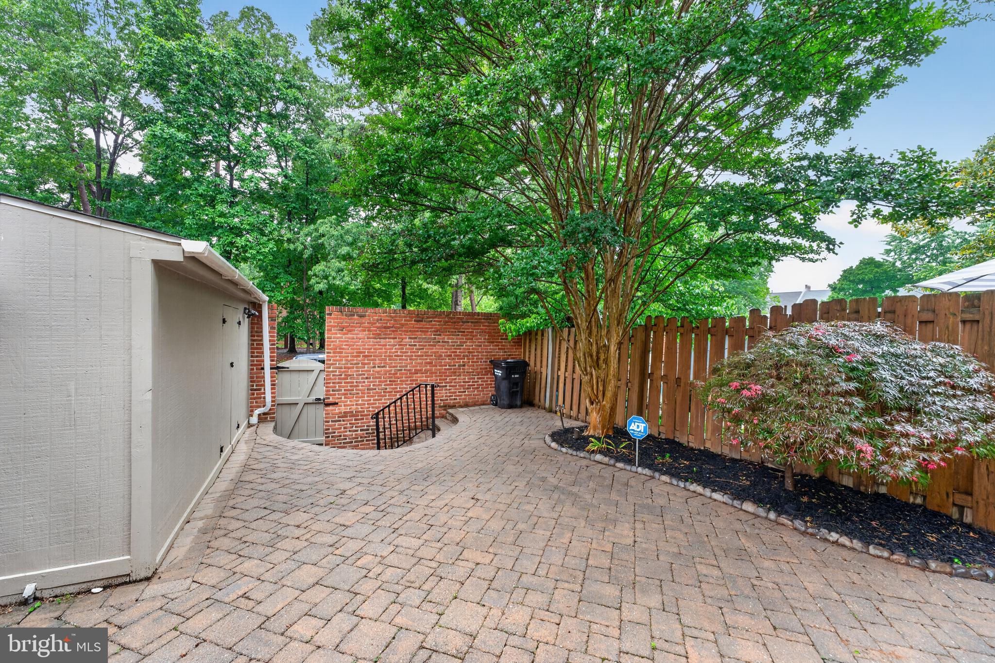 8139 Carrleigh Parkway Springfield, VA 22152 - Photo 12 of 27 a view of backyard with a small cabin and a chair