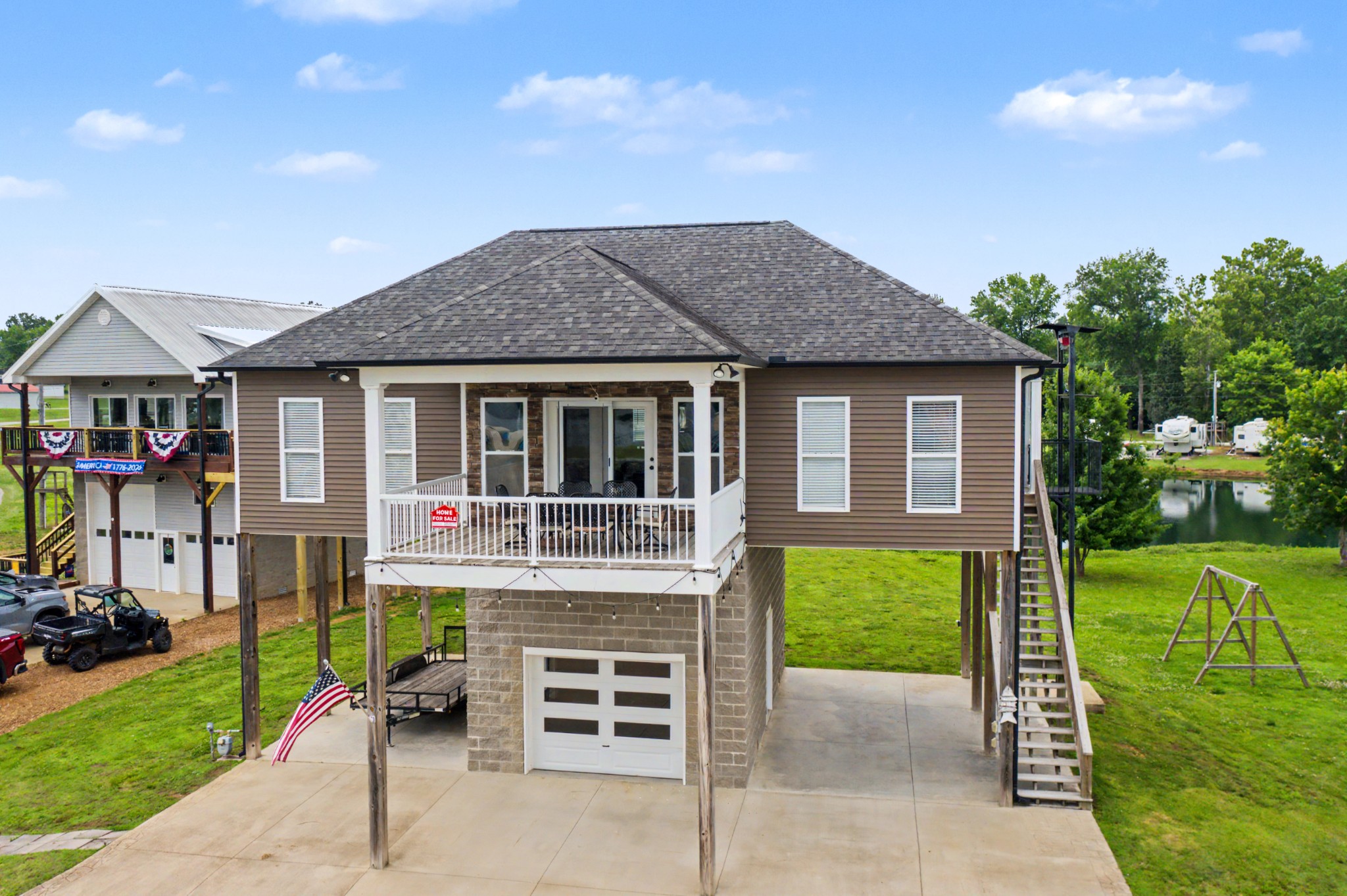 175 Ellen Lane Decaturville, TN 38329 - Photo 2 of 25 a front view of a house with a yard table and chairs