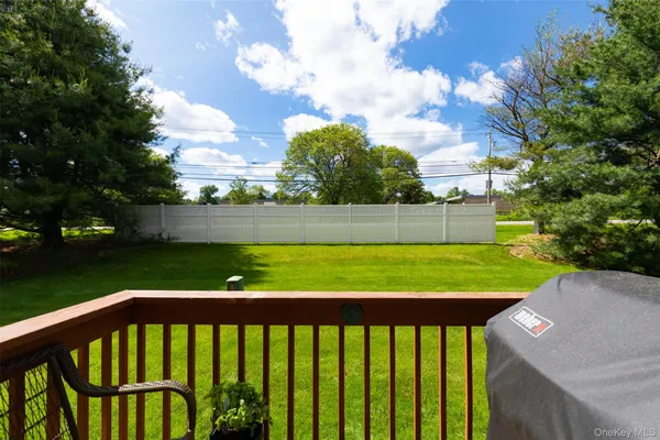 a view of a balcony with an outdoor seating