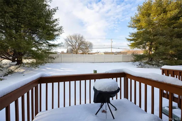 swimming pool view with a seating space