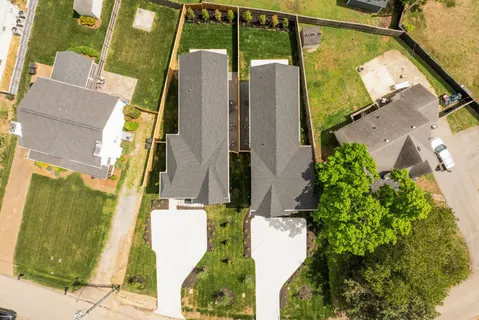 an aerial view of residential house with outdoor space