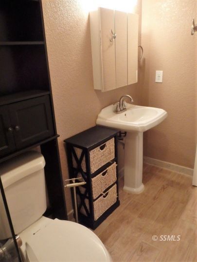 412 North Mono Street Ridgecrest, CA 93555 - Photo 41 of 50 a bathroom with a sink toilet and mirror