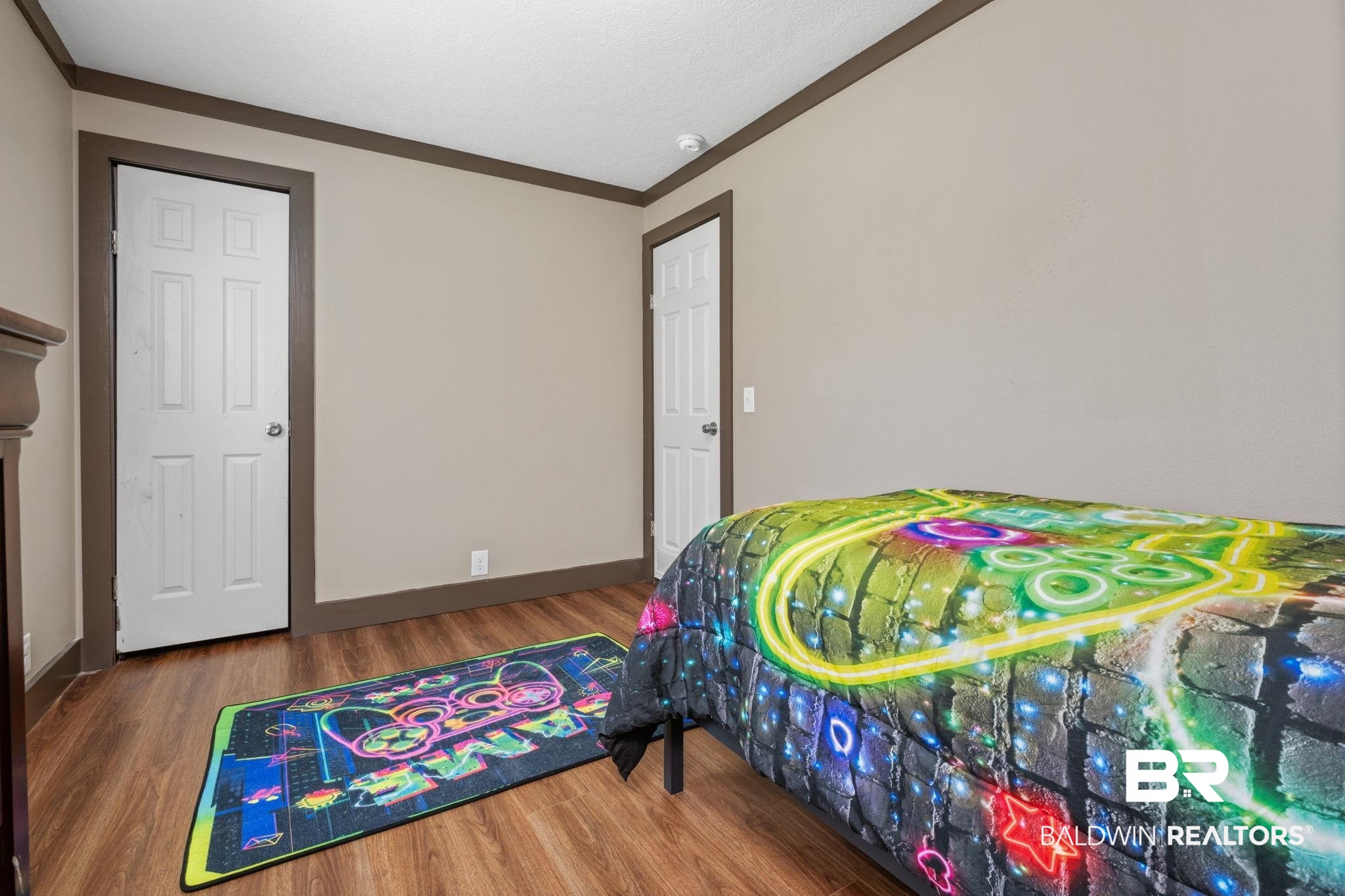 15080 Starlight Avenue Wilmer, AL 36587 - Photo 21 of 29 Bedroom with hardwood / wood-style flooring and crown molding