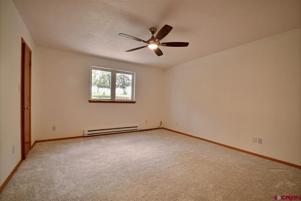 16874 Bull Mesa Road Cedaredge, CO 81413 - Photo 7 of 23 New Carpet, ceiling fan, 5 x 6 walk-in closet