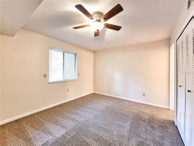 a view of a kitchen with a sink and cabinets