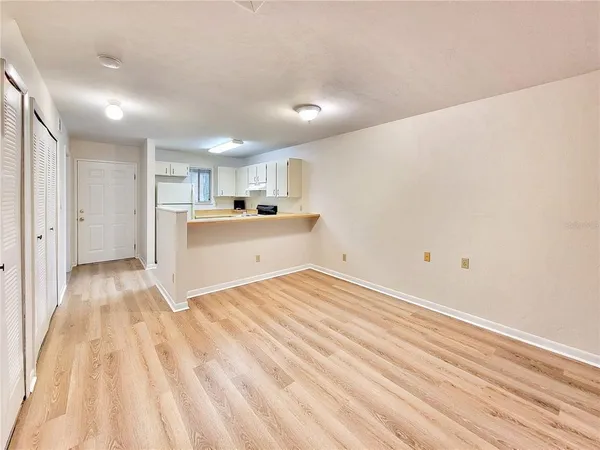 a view of a kitchen with a sink and cabinets
