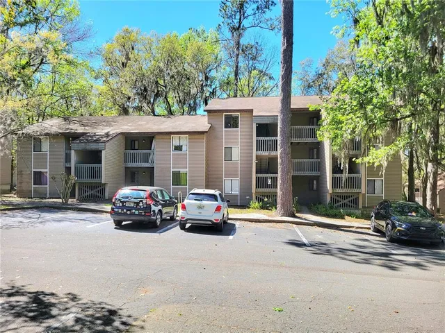 a car parked in front of a houses