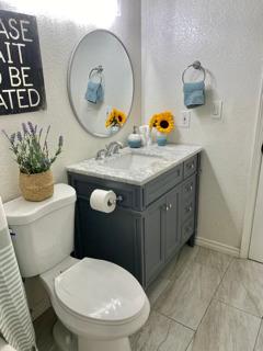 72 Rancho Drive, Unit D San Jose, CA 95111 - Photo 11 of 19 a bathroom with a toilet a sink and mirror