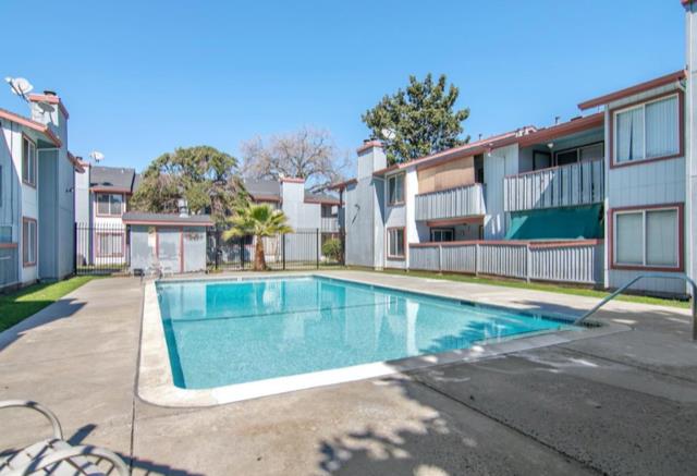 72 Rancho Drive, Unit D San Jose, CA 95111 - Photo 19 of 19 a view of a swimming pool with a lounge chairs