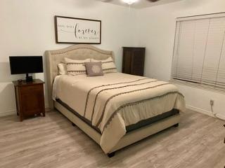 72 Rancho Drive, Unit D San Jose, CA 95111 - Photo 4 of 19 a bedroom with a bed and a flat screen tv