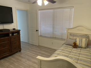 72 Rancho Drive, Unit D San Jose, CA 95111 - Photo 5 of 19 a bedroom with a bed and a flat tv screen on dresser