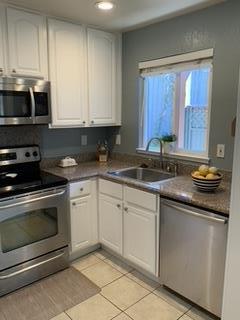 72 Rancho Drive, Unit D San Jose, CA 95111 - Photo 7 of 19 a kitchen with granite countertop white cabinets stainless steel appliances and a sink